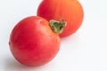 Close up a tomato on isolate white background.Selective focus red tomato. Royalty Free Stock Photo