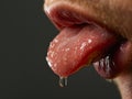 Close-up of Tongue with Honey Drop Royalty Free Stock Photo