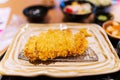 Close up of Tonkatsu panko breaded deep fried pork cutlet thai street food market