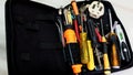 Close up of a tool bag with unsorted tools