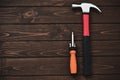 Close-up tools as hammer and screwdriver on a wooden background. work concept. free copyspace Royalty Free Stock Photo