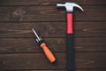 Close-up tools as hammer and screwdriver on a wooden background. work concept. free copyspace Royalty Free Stock Photo