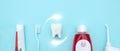 Close up of a toothbrush, toothpaste, irrigator, mouthwash for teeth, dental mirror with white molar tooth model and Protective Royalty Free Stock Photo