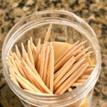 Close up of toothpicks in a container