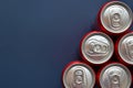 top of aluminium red cans soft drink put on blue texture background Royalty Free Stock Photo
