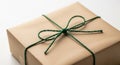 Brown Paper Wrapped Gift Box Tied With Green Twine Bow present kraft paper Royalty Free Stock Photo
