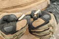 View of soldier hands load gun bullets into cartridge clip