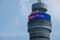 Close up of the top part of the iconic BT Tower, lit up in rainbow colours to celebrate the Gay Pride Parade in London.