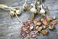 Close up, top shot of dry skins garlic bulbs, cloves, white, orange, purple colors, rustic wooden table background, selective Royalty Free Stock Photo