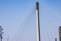 Close up top of suspension tower and cables of Bob Kerrey Pedestrian bridge in downtown Omaha