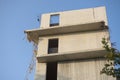 Close up of top three floors of a partly destroyed concrete building Royalty Free Stock Photo