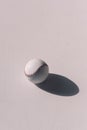 Close-up top view of baseball ball with shadow