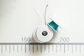 Close up, top view. Details. Sewing spools with black, blue and white threads Royalty Free Stock Photo