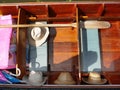 close up top view of floating wooden boat in thailand with vintage hats