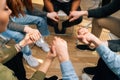 Close-up top view of group diverse multiethnic people holding hands together during the psychological therapy. Royalty Free Stock Photo
