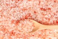 Close up top view of himalayan pink salt in wooden spoon Royalty Free Stock Photo