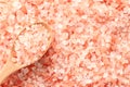 Close up top view of himalayan pink salt in wooden spoon Royalty Free Stock Photo