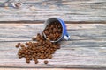 Close-up and top view of hot black coffee in blue coffee cup and roasted Thai coffee beans on wooden background Royalty Free Stock Photo