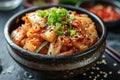 Close up top view kimchi cabbage in bowl on grey concrete background, healthy fermented pickled food