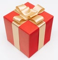 Close-up top view one red paper gift box golden bow ribbon Royalty Free Stock Photo