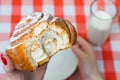 Close up top view photo of appetizing bitten cinnamon roll in wo Royalty Free Stock Photo