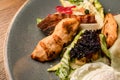 close-up top view of a piece of fried chicken and bacon in salad