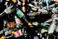 Close-up top view of a pile of discarded alcoholic glass drink bottles