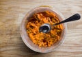 Close up top view on a plastic bucket container filled with spicy mango achar