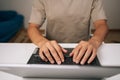 Close-up top view of programmer male hands typing code on laptop keyboard, showcasing process of software development Royalty Free Stock Photo