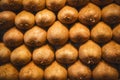 Close up, top view. Ripe kiwi are neatly laid out in rows on the counter at a Spanish bazaar Royalty Free Stock Photo