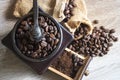 Close up top view Roasted coffee beans in wooden coffee grinder.