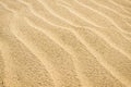 Close up top view of sand dune surface with ripple patterns formed by wind. Royalty Free Stock Photo