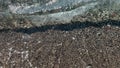 Close Up top view sea beach sea waves breaking on sandy coastline. Beautiful Turkish nature. Close-up shot of calming Royalty Free Stock Photo