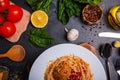 Close-up, top view, spaghetti with grated cheese and meatballs on a plate, wooden table. Royalty Free Stock Photo