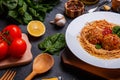 Close-up, top view, spaghetti with grated cheese and meatballs on a plate, wooden table. Royalty Free Stock Photo