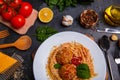 Close-up, top view, spaghetti with grated cheese and meatballs on a plate, wooden table. Royalty Free Stock Photo