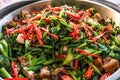 Close up top view stir fry chinese kale with chili and crispy pork