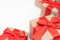 Close-up brown paper gift box red bow ribbon white background. concept for happy love gift Royalty Free Stock Photo