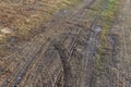 Close up top view of tire pattern from wheel mark trail on agricultural soil Royalty Free Stock Photo