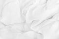 Close up top view of white bedding sheet and wrinkle messy blanket in bedroom after wake up in the morning Royalty Free Stock Photo