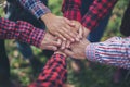 Close up top view of young business people putting their hands together. Unity and teamwork Royalty Free Stock Photo