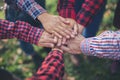 Close up top view of young business people putting their hands together. Unity and teamwork Royalty Free Stock Photo