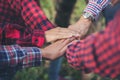 Close up top view of young business people putting their hands together. Unity and teamwork Royalty Free Stock Photo