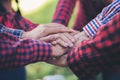 Close up top view of young business people putting their hands together. Unity and teamwork Royalty Free Stock Photo