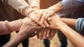 Close up top view of young people putting their hands together. Friends with stack of hands showing unity and teamwork