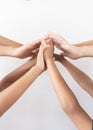 Close up top view of young people putting their hands together. Friends with stack of hands showing unity and teamwork. Royalty Free Stock Photo