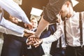 Close up top view of young people putting their hands together. A team of young businessmen working and communicating Royalty Free Stock Photo