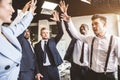 Close up top view of young people putting their hands together. A team of young businessmen working and communicating Royalty Free Stock Photo