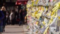 Close-up of torn adverts on wall