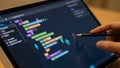 Close-up of touchscreen showing coding lesson with animated syntax highlights, tech education Royalty Free Stock Photo